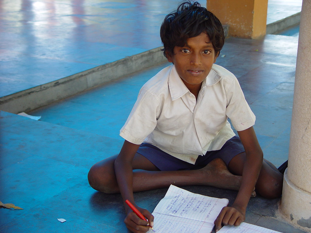 A schoolboy studying in rural India